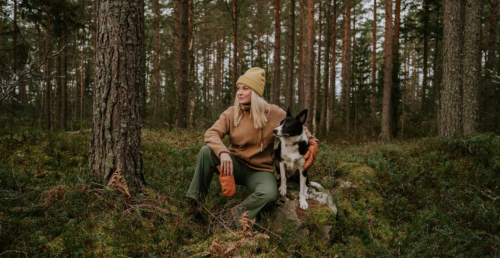 Dog and woman in the woods